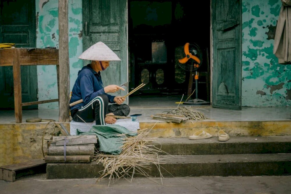 A local artisan carefully hand-carved bamboo